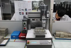 Semi-auto gluing iron core equipment at UNION TEAM ELECTRONICS